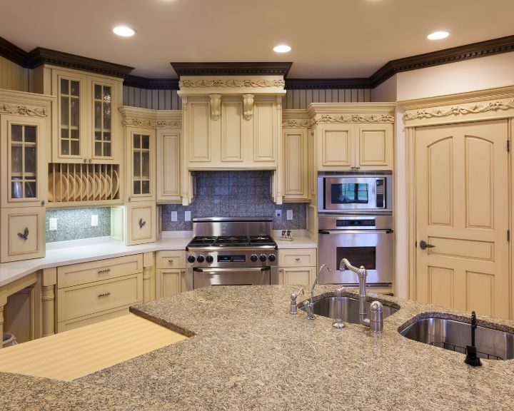 a kitchen with a stove, oven, sink and refrigerator.